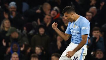 Manchester City's Spanish midfielder #16 Rodri celebrates after scoring his team third goal during the English Premier League football match between Manchester City and Burnley at the Etihad Stadium in Manchester, north west England, on January 31, 2024. (Photo by Darren Staples / AFP) / RESTRICTED TO EDITORIAL USE. No use with unauthorized audio, video, data, fixture lists, club/league logos or 'live' services. Online in-match use limited to 120 images. An additional 40 images may be used in extra time. No video emulation. Social media in-match use limited to 120 images. An additional 40 images may be used in extra time. No use in betting publications, games or single club/league/player publications. / 