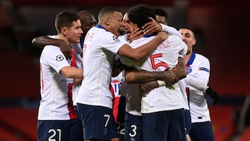 MANCHESTER, ENGLAND - DECEMBER 02: Marquinhos of Paris Saint-Germain celebrates with team mates Kylian Mbappe and Ander Herrera (L) after scoring their sides second goal during the UEFA Champions League Group H stage match between Manchester United and Pa