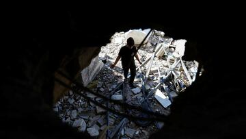 A Palestinian boy stands amidst the rubble at the site of an Israeli air strike in Tulkarm camp, in Tulkarm, in the Israeli-occupied West Bank, October 4, 2024. REUTERS/Raneen Sawafta