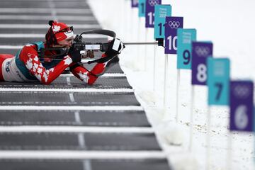 Canada's Nathan Smith shoots during the Men's 10km Sprint Biathlon