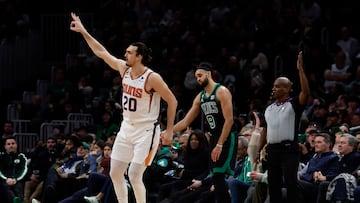 Feb 3, 2023; Boston, Massachusetts, USA; As Boston Celtics guard Derrick White (9) hangs his head, Phoenix Suns forward Dario Saric (20) celebrates after making a three point basket during the second half at TD Garden. Mandatory Credit: Winslow Townson-USA TODAY Sports