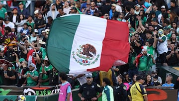 OAKLAND, CALIFORNIA - SEPTEMBER 6: Fans of Mexico wave a flag before an international friendly match between Mexico and Japan at Oakland Alameda Coliseum on September 6, 2025 in Oakland, California. (Photo by Omar Vega/Getty Images)