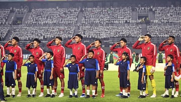 Indonesia's players sing the national anthem before the FIFA U-17 World Cup Indonesia 2023 Group A match between Indonesia and Ecuador at the Gelora Bung Tomo Stadium in Surabaya on November 10, 2023. (Photo by Juni Kriswanto / AFP)