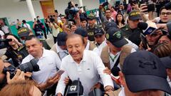 Colombian independent presidential candidate Rodolfo Hernandez (C) arrives at a polling station to cast his vote during the presidential runoff election in Bucaramanga, Colombia, on June 19, 2022. - Colombians vote for a new president in an election filled with uncertainty, as former guerrilla Gustavo Petro and millionaire businessman Rodolfo Hernandez vie for power in a country saddled with widespread poverty, violence and other woes. (Photo by Schneyder MENDOZA / AFP) (Photo by SCHNEYDER MENDOZA/AFP via Getty Images)