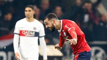 Soccer Football - Ligue 1 - Lille v Paris St Germain - Stade Pierre-Mauroy, Villeneuve-d'Ascq, France - December 17, 2023 Lille's Nabil Bentaleb celebrates after Jonathan David scores their first goal REUTERS/Abdul Saboor