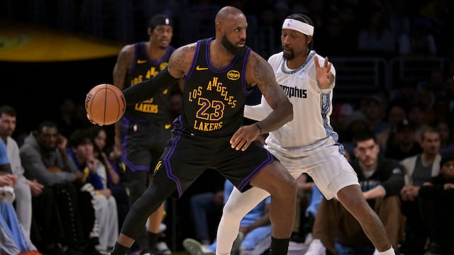 Jan 2, 2026; Los Angeles, California, USA; Los Angeles Lakers forward LeBron James (23) is defended by Memphis Grizzlies guard Kentavious Caldwell-Pope (3) in the second half at Crypto.com Arena. Mandatory Credit: Jayne Kamin-Oncea-Imagn Images