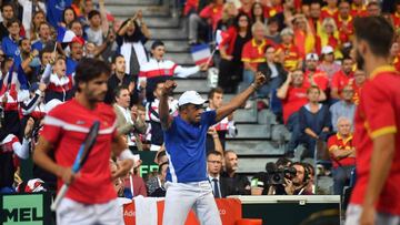 France's team captain Yannick Noah celebrates after the victory of France's Nicolas Mahut and Julien Benneteau during their doubles rubber against Spain's Marcel Granollers (R) and Feliciano Lopez (L) for the Davis Cup semi-final tennis mat
