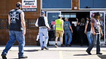 STURGIS, SD - AUGUST 09: A sign about social distancing sits outside the Full Throttle Saloon during the 80th Annual Sturgis Motorcycle Rally in Sturgis, South Dakota on August 9, 2020. While the rally usually attracts around 500,000 people, officials estimate that more than 250,000 people may still show up to this year&#039;s festival despite the coronavirus pandemic.   Michael Ciaglo/Getty Images/AFP
 == FOR NEWSPAPERS, INTERNET, TELCOS &amp; TELEVISION USE ONLY ==