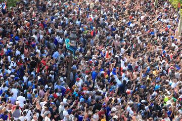 Soccer Football - World Cup - France Victory Parade on the Champs Elysees - Paris, France - July 16, 2018 France fans gather as they await the arrival of the team