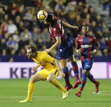 Levante forward Enes Ünal outjumps Godín.