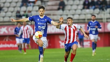 Juanma García disputando un esférico junto a Nico Van Rijn.