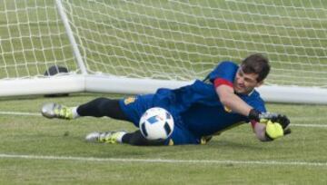 Iker Casillas dives to make a save.