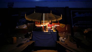 A man awaits customers as he stands at his noodle cafe while authorites continue the 14 days lockdown in a bid to contain the spread of coronavirus disease (COVID 19) in Abuja, Nigeria April 5, 2020. Picture taken April 5, 2020. REUTERS/Afolabi Sotunde