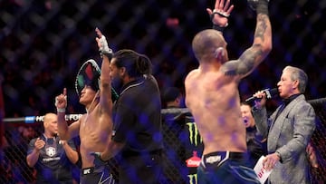 LAS VEGAS, NEVADA - DECEMBER 10: (L-R) Raul Rosas Jr. reacts after defeating Jay Perrin in a featherweight fight during the UFC 282 event at T-Mobile Arena on December 10, 2022 in Las Vegas, Nevada.   Sean M. Haffey/Getty Images/AFP (Photo by Sean M. Haffey / GETTY IMAGES NORTH AMERICA / Getty Images via AFP)