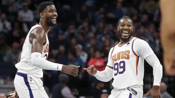 Mar 23, 2022; Minneapolis, Minnesota, USA; Phoenix Suns center Deandre Ayton (22) celebrates with forward Jae Crowder (99) after making a three point basket against the Minnesota Timberwolves to set his personal best for points in a game at Target Center.