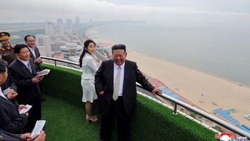 North Korean leader Kim Jong Un and his daughter Kim Ju Ae stand on a balcony facing the beach during a ceremony to celebrate the completion of the Wonsan Kalma Coastal Tourist Zone, in Wonsan, in North Korea, June 24, 2025. KCNA via REUTERS ATTENTION EDITORS - THIS IMAGE WAS PROVIDED BY A THIRD PARTY. REUTERS IS UNABLE TO INDEPENDENTLY VERIFY THIS IMAGE. NO THIRD PARTY SALES. SOUTH KOREA OUT. NO COMMERCIAL OR EDITORIAL SALES IN SOUTH KOREA. TPX IMAGES OF THE DAY