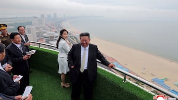 North Korean leader Kim Jong Un and his daughter Kim Ju Ae stand on a balcony facing the beach during a ceremony to celebrate the completion of the Wonsan Kalma Coastal Tourist Zone, in Wonsan, in North Korea, June 24, 2025. KCNA via REUTERS ATTENTION EDITORS - THIS IMAGE WAS PROVIDED BY A THIRD PARTY. REUTERS IS UNABLE TO INDEPENDENTLY VERIFY THIS IMAGE. NO THIRD PARTY SALES. SOUTH KOREA OUT. NO COMMERCIAL OR EDITORIAL SALES IN SOUTH KOREA. TPX IMAGES OF THE DAY