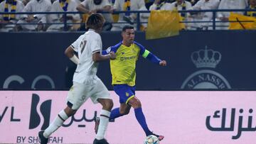 Shabab's Saudi defender Fawaz al-Sqoor (L) marks Nassr's Portuguese forward Cristiano Ronaldo during the Saudi Pro League football match between Al-Nassr and Al-Shabab at the al-Awwal Park Stadium in Riyadh on May 23, 2023. (Photo by Fayez NURELDINE / AFP)