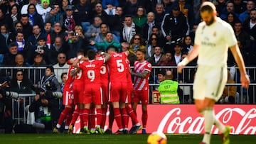 Girona&#039;s players celebrate after scoring a penalty during the Spanish League football match between Real Madrid and Girona at the Santiago Bernabeu stadium in Madrid on February 17, 2019. (Photo by GABRIEL BOUYS / AFP)