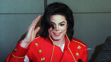 Michael Jackson waves to photographers during a 1996 press conference in Paris. The first posthumous albumÂ by the King of Pop, who died in 2009, has been trailed by controversy since its 2010 release