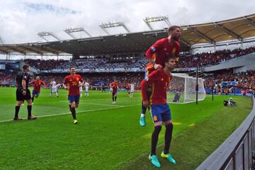 Pique (R) of Spain celebrates scoring his team's first goal with his team mate Sergio Ramos during the UEFA EURO 2016 Group D match