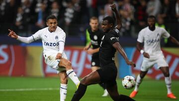 FRANKFURT AM MAIN, GERMANY - OCTOBER 26: Alexis Sanchez of Olympique Marseille takes a shot on goal whilst under pressure from Evan N'Dicka of Eintracht Frankfurt  during the UEFA Champions League group D match between Eintracht Frankfurt and Olympique Marseille at Deutsche Bank Park on October 26, 2022 in Frankfurt am Main, Germany. (Photo by Alex Grimm/Getty Images)