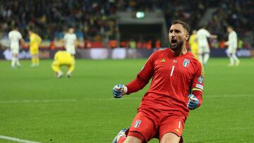 Italy's goalkeeper #01 Gianluigi Donnarumma celebrates at the final whistle of the UEFA EURO 2024 Group C qualifying football match between Ukraine and Italy at the BayArena Stadium in Leverkusen, western Germany on November 20, 2023. (Photo by LEON KUEGELER / AFP)