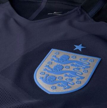 England unveil new dark blue away kit