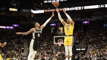 Oct 26, 2021; San Antonio, Texas, USA; Los Angeles Lakers guard Russell Westbrook (0) shoots over San Antonio Spurs guard Dejounte Murray (5) in the second half at AT&T Center. Mandatory Credit: Scott Wachter-USA TODAY Sports
