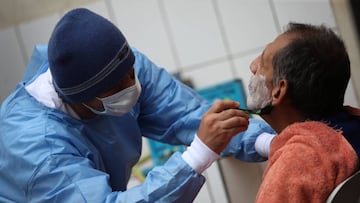 LIMA, PERU - JUNE 25: A nurse shaves a patient at Victor Larco Herrera Mental Hospital on June 25, 2020 in Lima, Peru. Tests carried at the largest mental hospital in Peru confirmed that 162 of of 342 patients and 121 workers were infected with COVID-19. Authorities informed 95 patients have already recovered. Peru is the second worst-hit country in Latin America with 264.689 positive cases, only after Brazil. (Photo by Raul Sifuentes/Getty Images)