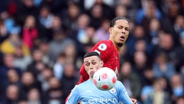 Soccer Football - Premier League - Manchester City v Liverpool - Etihad Stadium, Manchester, Britain - April 10, 2022 Manchester City's Phil Foden in action with Liverpool's Virgil van Dijk Action Images via Reuters/Carl Recine EDITORIAL USE ONLY. No use with unauthorized audio, video, data, fixture lists, club/league logos or 'live' services. Online in-match use limited to 75 images, no video emulation. No use in betting, games or single club /league/player publications.  Please contact your account representative for further details.