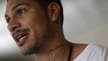 Peru national soccer team captain Paolo Guerrero talks during an interview with Reuters in Rio de Janeiro, Brazil December 21, 2017. His tattoo reads "Faith". REUTERS/Ricardo Moraes