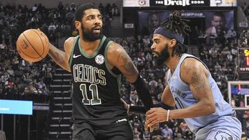Dec 29, 2018; Memphis, TN, USA; Boston Celtics guard Kyrie Irving (11) handles the ball against Memphis Grizzlies guard Mike Conley (11) during the second half at FedExForum. Boston Celtics defeated the Memphis Grizzlies 123-103. Mandatory Credit: Justin Ford-USA TODAY Sports
