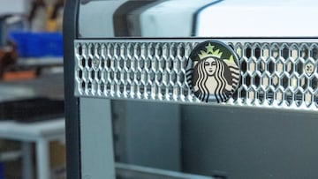 A Starbucks logo is displayed on a fully automatic coffee machine made by Swiss manufacturer Thermoplan in its plant, amid the 39% U.S. tariffs on Swiss goods that threaten profit margins and are forcing the company to consider relocating production to remain competitive, in Weggis, Switzerland, August 27, 2025. REUTERS/Denis Balibouse