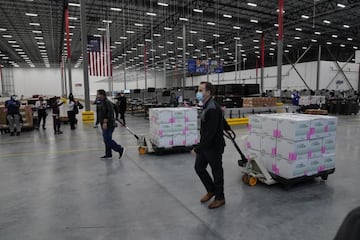 Boxes containing the Moderna COVID-19 vaccine are prepared to be shipped at the McKesson distribution center in Olive Branch, Mississippi, USA, 20 December 2020.