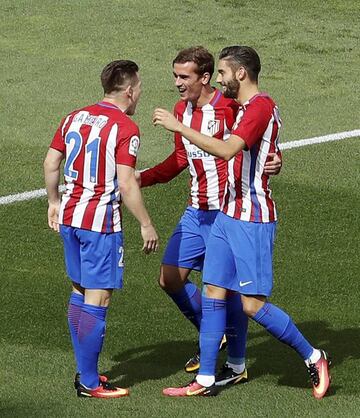 Atletico's trio celebrate during a game