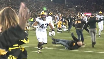 Gridiron fan gets flattened in post-match celebration