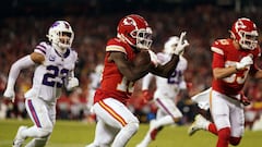 Jan 23, 2022; Kansas City, Missouri, USA; Kansas City Chiefs wide receiver Tyreek Hill (10) carries the ball up the field for a touchdown against the Buffalo Bills during the fourth quarter of the AFC Divisional playoff football game at GEHA Field at Arro