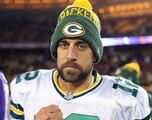 What draft position was Aaron Rodgers selected for, and what college did he play for?