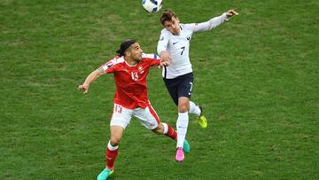 LILLE, FRANCE - JUNE 19: Antoine Griezmann of France and Ricardo Rodriguez of Switzerland compete for the ball during the UEFA EURO 2016 Group A match between Switzerland and France at Stade Pierre-Mauroy on June 19, 2016 in Lille, France. (Photo by Shaun Botterill/Getty Images)