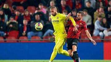 MALLORCA, SPAIN - FEBRUARY 18: Dani Rodriguez of RCD Mallorca competes for the ball with Etienne Capoue of Villarreal CF during the LaLiga Santander match between RCD Mallorca and Villarreal CF at Estadi Mallorca Son Moix on February 18, 2023 in Mallorca, Spain. (Photo by Cristian Trujillo/Quality Sport Images/Getty Images)