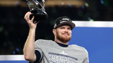 SEATTLE, WASHINGTON - JANUARY 25: Sam Darnold #14 of the Seattle Seahawks celebrates with the George Halas Trophy after defeating the Los Angeles Rams 31-27 in the NFC Championship game at Lumen Field on January 25, 2026 in Seattle, Washington. Steph Chambers/Getty Images/AFP (Photo by Steph Chambers / GETTY IMAGES NORTH AMERICA / Getty Images via AFP)
