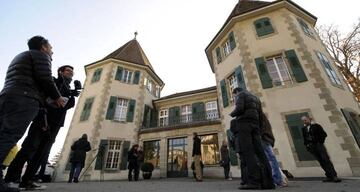 Journalists wait outside of the Court of Arbitration