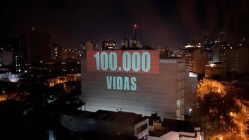 A projection on a building honours the 100,000 victims who died of the novel coronavirus COVID-19 in Brazil as the country became the second in the world to pass the grim milestone, in Botafogo neighbourhood in Rio de Janeiro, Brazil, on August 8, 2020. -