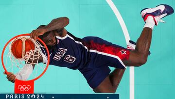 USA's #06 LeBron James dunks the ball in the men's preliminary round group C basketball match between Serbia and USA during the Paris 2024 Olympic Games at the Pierre-Mauroy stadium in Villeneuve-d'Ascq, northern France, on July 28, 2024. (Photo by POOL / AFP)