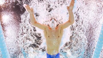 An underwater view shows France�s Leon Marchand competing in the heats of the men's 200m individual medley swimming event during the Paris 2024 Olympic Games at the Paris La Defense Arena in Nanterre, west of Paris on August 1, 2024. (Photo by Manan VATSYAYANA / AFP)