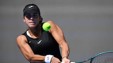 Spain's Jessica Bouzas Maneiro hits a return to Russia's Mirra Andreeva during their women's singles match at the China Open tennis tournament in Beijing on September 29, 2025. (Photo by WANG Zhao / AFP)