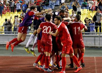 Football Soccer - Syria v Australia - 2018 World Cup Qualifying Asia Zone Playoffs - Hang Jebat Stadium, Melaka, Malaysia - October 5, 2017. Teammates celebrate with Syria's Omar Al Soma after he converted a penalty kick. REUTERS/Lai Seng Sin