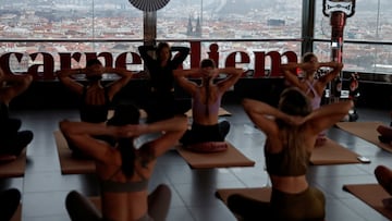 People practice yoga at the Zizkov Television Tower in Prague, Czech Republic, February 27, 2025. REUTERS/David W Cerny