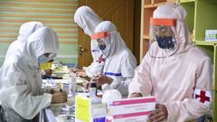 FILE PHOTO: Members of the North Korean army supply medicines to residents at a pharmacy, amid growing fears over the spread of the coronavirus disease (COVID-19), in Pyongyang, North Korea, in this photo released by Kyodo on May 18, 2022. Mandatory credit Kyodo/via REUTERS ATTENTION EDITORS - THIS IMAGE WAS PROVIDED BY A THIRD PARTY. MANDATORY CREDIT. JAPAN OUT. NO COMMERCIAL OR EDITORIAL SALES IN JAPAN./File Photo/File Photo